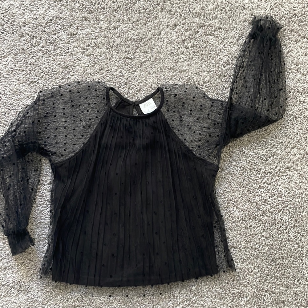 Black top with polka dots